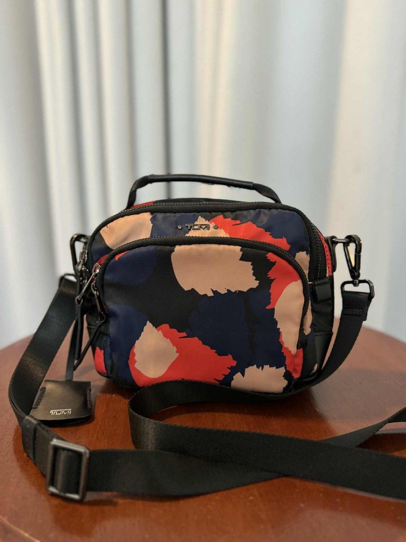 Tumi Cross Body Bag (Category: Backpacks) located in San Fernando. Submitted by mandts_closet (Listing ID 1403316916, Image 1). Description: Tumi Multicolored Cross Body Authentic No issues Sold as is. For shipping only..