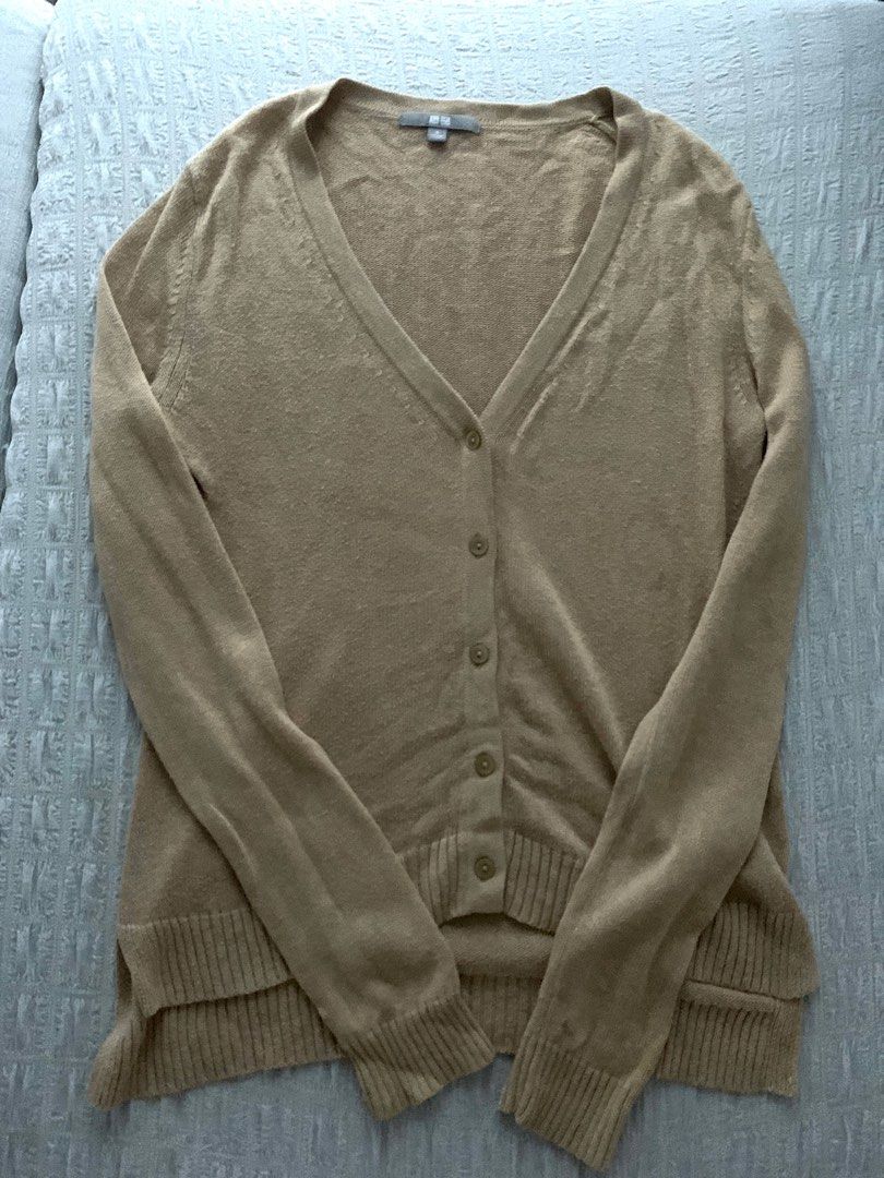 Uniqlo V-Neck Cardigan (Category: Coats, Jackets and Outerwear) located in Paranaque City. Submitted by smconsul (Listing ID 1403281223, Image 1). Description: - Uniqlo V-neck cardigan - Button closure - Long sleeves - Ribbed hem - Neutral color - Great for layering - Size tag visible - Versatile style 21 x 17.