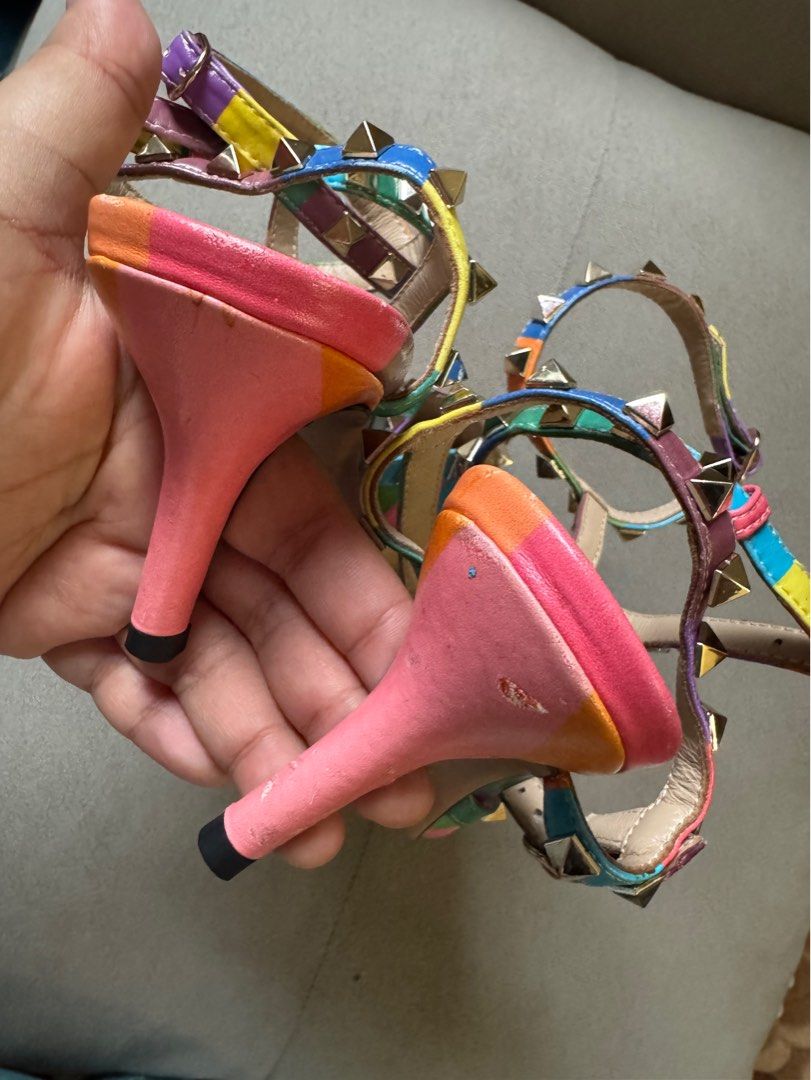 Valentino Garavani 1973 Rockstud Chevron Rainbow (Category: Heels) located in Manila. Submitted by ninibuys00 (Listing ID 1403384282, Image 3). Description: - Valentino Garavani 1973 Rockstud Chevron Rainbow Heels - Limited Edition Rainbow Collection - Size: EU 35 - Pointed toe design - Features iconic Rockstud embellishments - Vibrant rainbow color scheme - issues seen on the pictures RFS : helping my sister declutter/sell her pre-loved heels.