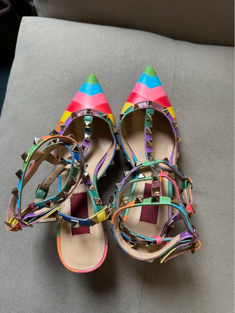 Valentino Garavani 1973 Rockstud Chevron Rainbow (Category: Heels) located in Manila. Submitted by ninibuys00 (Listing ID 1403384282, Image 2). Description: - Valentino Garavani 1973 Rockstud Chevron Rainbow Heels - Limited Edition Rainbow Collection - Size: EU 35 - Pointed toe design - Features iconic Rockstud embellishments - Vibrant rainbow color scheme - issues seen on the pictures RFS : helping my sister declutter/sell her pre-loved heels.