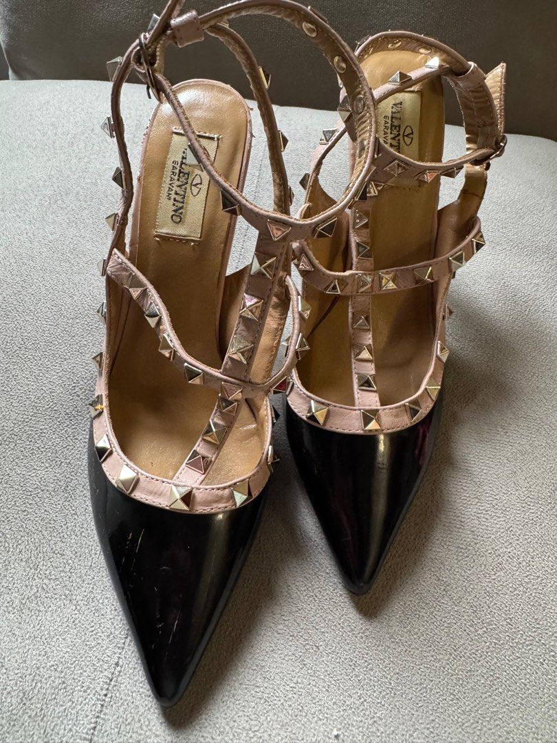Valentino Garavani Rockstud Heels - Black (Category: Heels) located in Manila. Submitted by ninibuys00 (Listing ID 1403380603, Image 2). Description: - Valentino Garavani Rockstud Heels - Black Patent Leather - Leather marks on sole - Size 35 EU - Signature pyramid studs - Pointed Toe & Ankle Strap.
