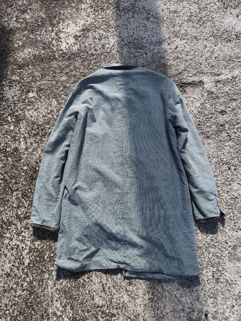Visvim Checked Coat (Category: Coats, Jackets and Outerwear) located in Kuala Lumpur. Submitted by xclayzzy (Listing ID 1403396841, Image 2). Description: Visvim checked coat. Features a button-up front, collar, and long sleeves. The coat has a blue and white checkered pattern. The label indicates the coat is made in Japan and is a size 3. The material composition includes cotton and linen..