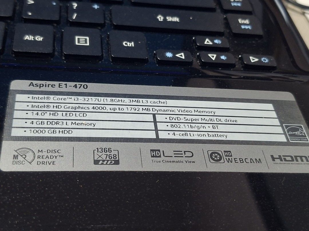 Acer Aspire E1-470 Laptop with issue (Category: Laptops & Notebooks) located in Bulacan. Submitted by rafaesarisari (Listing ID 1403481137, Image 2). Description: Acer Aspire E1-470 laptop with Intel Core i3-3217U processor, 4GB DDR3L memory, and a 1000GB HDD. It features a 14.0" HD LED LCD screen, DVD-Super Multi DL drive, and 802.11b/g/n + BT. Includes a 4-cell Li-ion battery. The laptop is shown powered on. With new battery ( replaced new one 