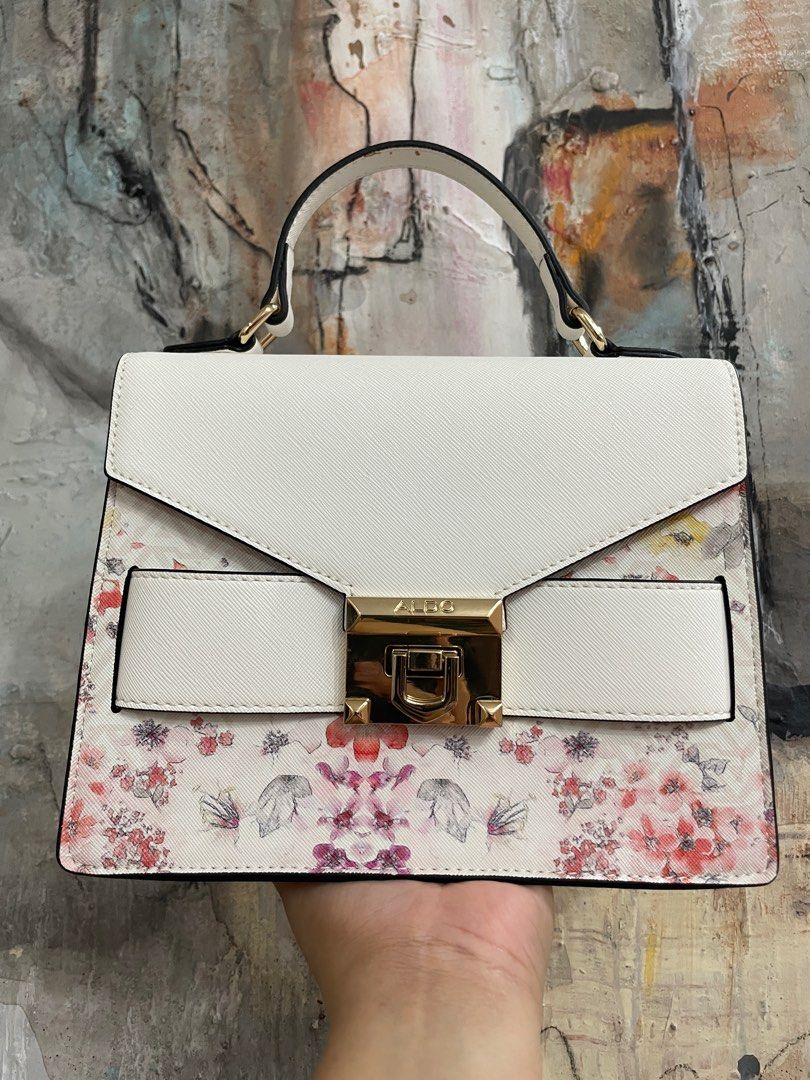 ALDO Floral Handbag with Top Handle (Category: Cross-body Bags) located in Las Pinas. Submitted by thingsupforgrab (Listing ID 1403535300, Image 1). Description: - Top handle and cross-body strap included - Kindly check photos for stains due to storage - Perfect for everyday use or special occasions .
