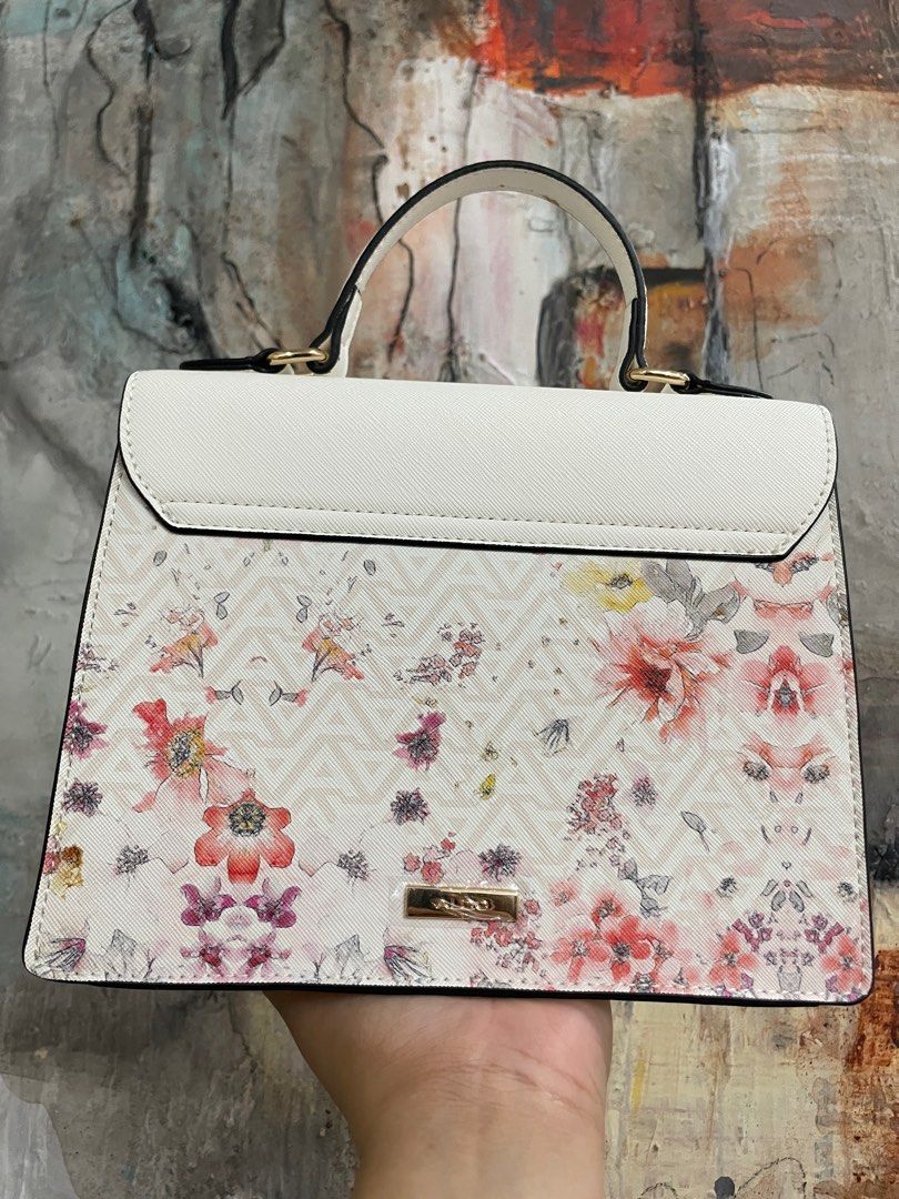 ALDO Floral Handbag with Top Handle (Category: Cross-body Bags) located in Las Pinas. Submitted by thingsupforgrab (Listing ID 1403535300, Image 3). Description: - Top handle and cross-body strap included - Kindly check photos for stains due to storage - Perfect for everyday use or special occasions .