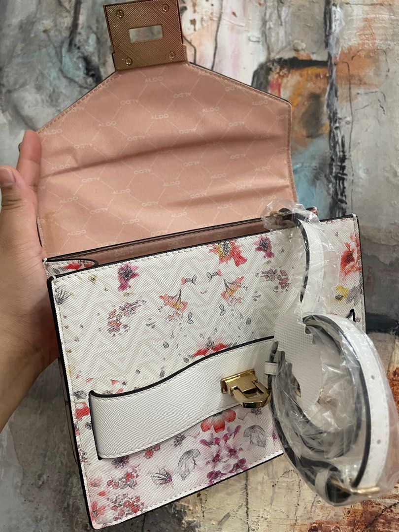 ALDO Floral Handbag with Top Handle (Category: Cross-body Bags) located in Las Pinas. Submitted by thingsupforgrab (Listing ID 1403535300, Image 2). Description: - Top handle and cross-body strap included - Kindly check photos for stains due to storage - Perfect for everyday use or special occasions .