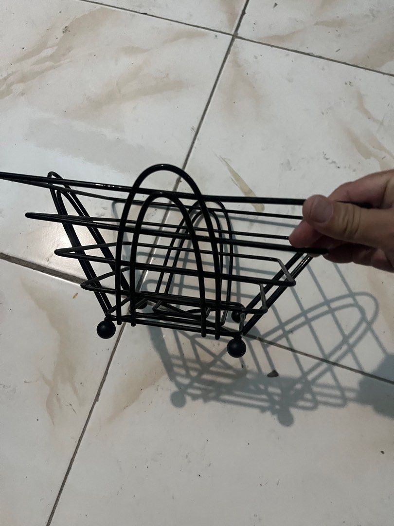 Black Metal wire Fruit Basket (Category: Storage Boxes & Baskets) located in Pasay City. Submitted by beye01 (Listing ID 1403459606, Image 3). Description: - Black metal basket - Unique square design - Multiple layers - Features a handle - Perfect for fruits and other items - Sturdy construction - Stylish kitchen accessory.