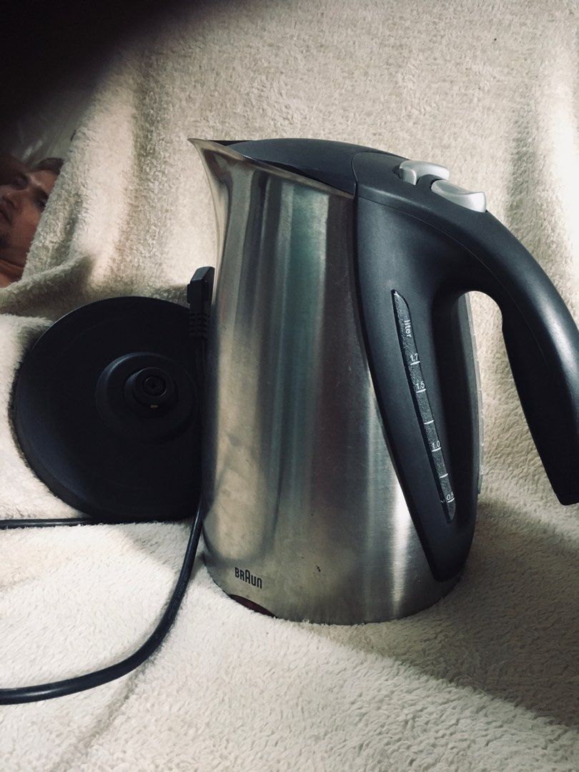 Braun Electric Kettle (Category: Kettles & Airpots) located in Manila. Submitted by noemiaspa1702 (Listing ID 1403479025, Image 1). Description: - Braun electric kettle - Stainless steel body - Black handle and lid - Water level indicator - Separate circular base - Power button - Easy-pour spout - Braun logo visible.