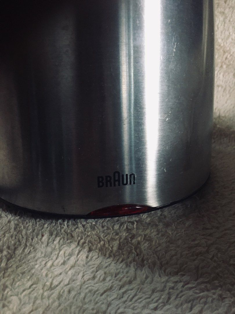 Braun Electric Kettle (Category: Kettles & Airpots) located in Manila. Submitted by noemiaspa1702 (Listing ID 1403479025, Image 3). Description: - Braun electric kettle - Stainless steel body - Black handle and lid - Water level indicator - Separate circular base - Power button - Easy-pour spout - Braun logo visible.