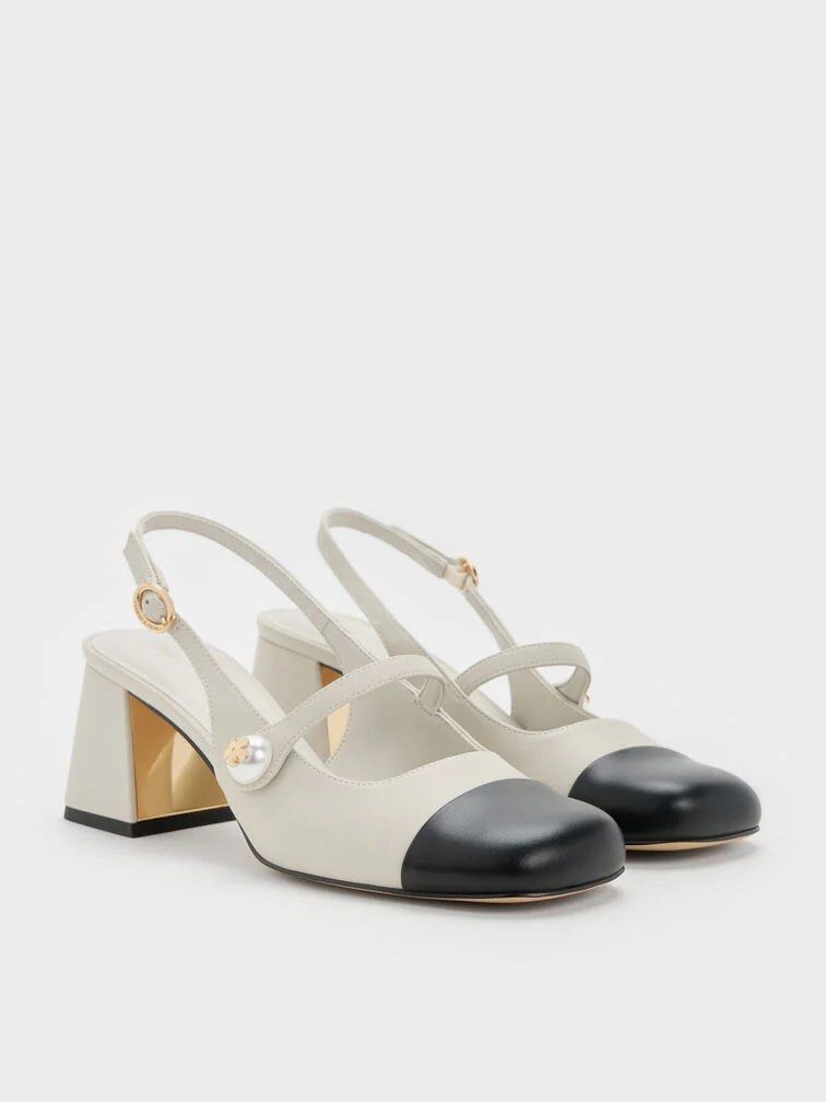 Charles & Keith Slingback Heels (Category: Heels) located in Davao. Submitted by declutterstuff01 (Listing ID 1403566307, Image 1). Description: - Charles & Keith slingback heels - Two-tone design - Black toe cap - Pearl detail - Block heel - Suitable for casual and formal wear.