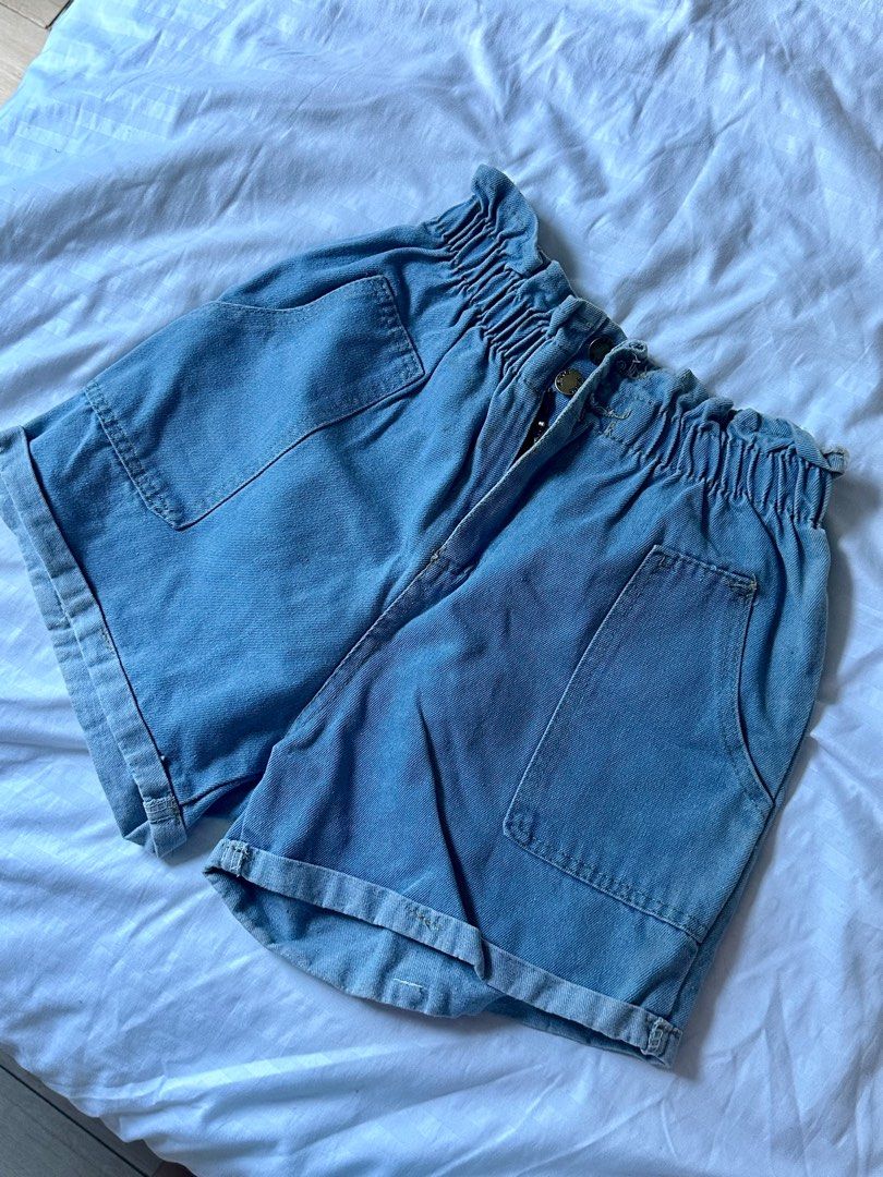 Denim Shorts with Pockets (Category: Shorts) located in Taguig. Submitted by dentisimo (Listing ID 1403508018, Image 1). Description: - Light blue denim shorts - High-waisted design - Two front pockets - Button closure - Elasticated waistband - Rolled-up hem - Perfect for casual wear.