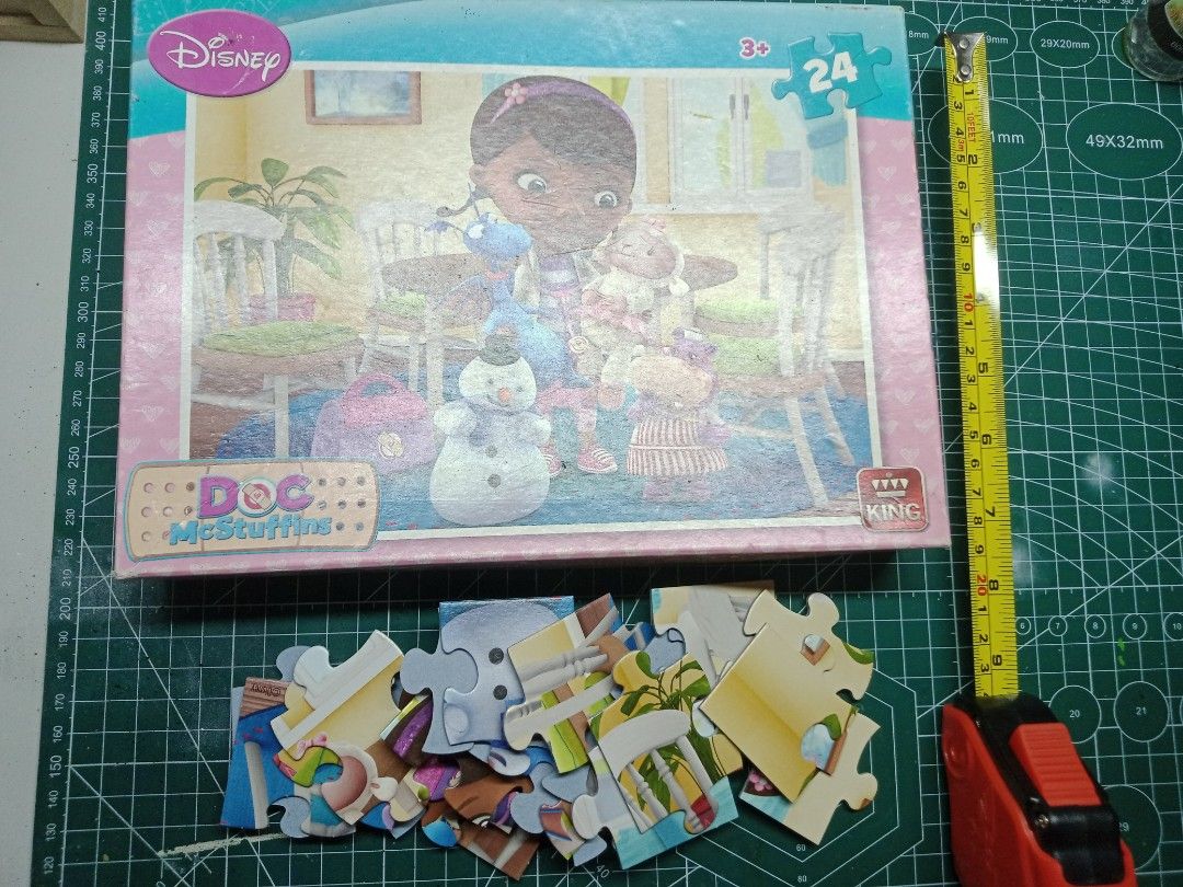 Disney Doc McStuffins 24-Piece Puzzle (Category: Board Games & Puzzles) located in Manila. Submitted by busy_market (Listing ID 1403603235, Image 1). Description: - 24-piece Doc McStuffins puzzle - Features Doc McStuffins and her friends - Comes in a box with a pink border - Includes the Disney logo - Suitable for ages 3 and up.