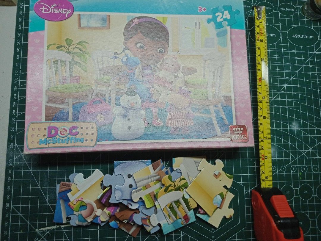 Disney Doc McStuffins 24-Piece Puzzle (Category: Board Games & Puzzles) located in Manila. Submitted by busy_market (Listing ID 1403603235, Image 2). Description: - 24-piece Doc McStuffins puzzle - Features Doc McStuffins and her friends - Comes in a box with a pink border - Includes the Disney logo - Suitable for ages 3 and up.