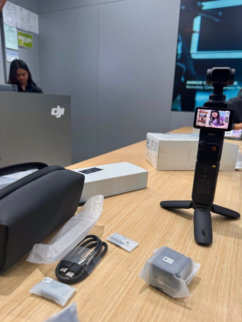 DJI Osmo Pocket 3 (Category: Cameras) located in Manila. Submitted by bestfindsbynes (Listing ID 1403576634, Image 2). Description: DJI Osmo Pocket 3. Includes the camera, a carrying case, a tripod, charging cable, and other accessories. Comes with the original box. The camera is black. With receipt bought at DJI megamall and warranty is still covered. .