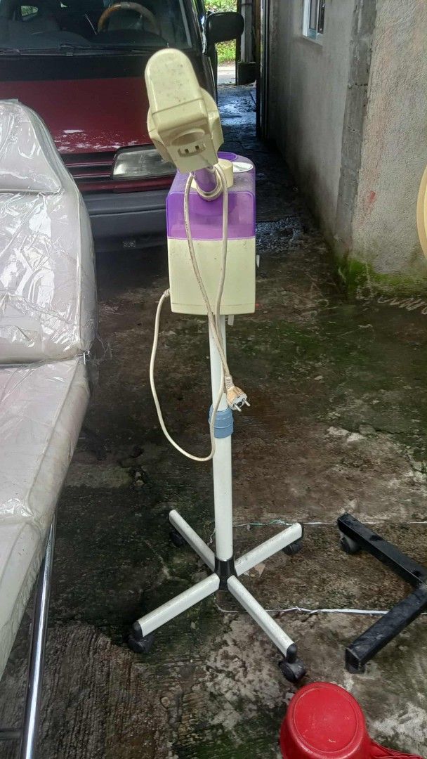 Facial Steamer with Stand (Category: Face Care) located in Manila. Submitted by wisegem-231b (Listing ID 1403466843, Image 3). Description: - Facial steamer with stand - Stylish cream and purple design - Features a nozzle for directed steam - In excellent working condition - Perfect for professional salons or home use.