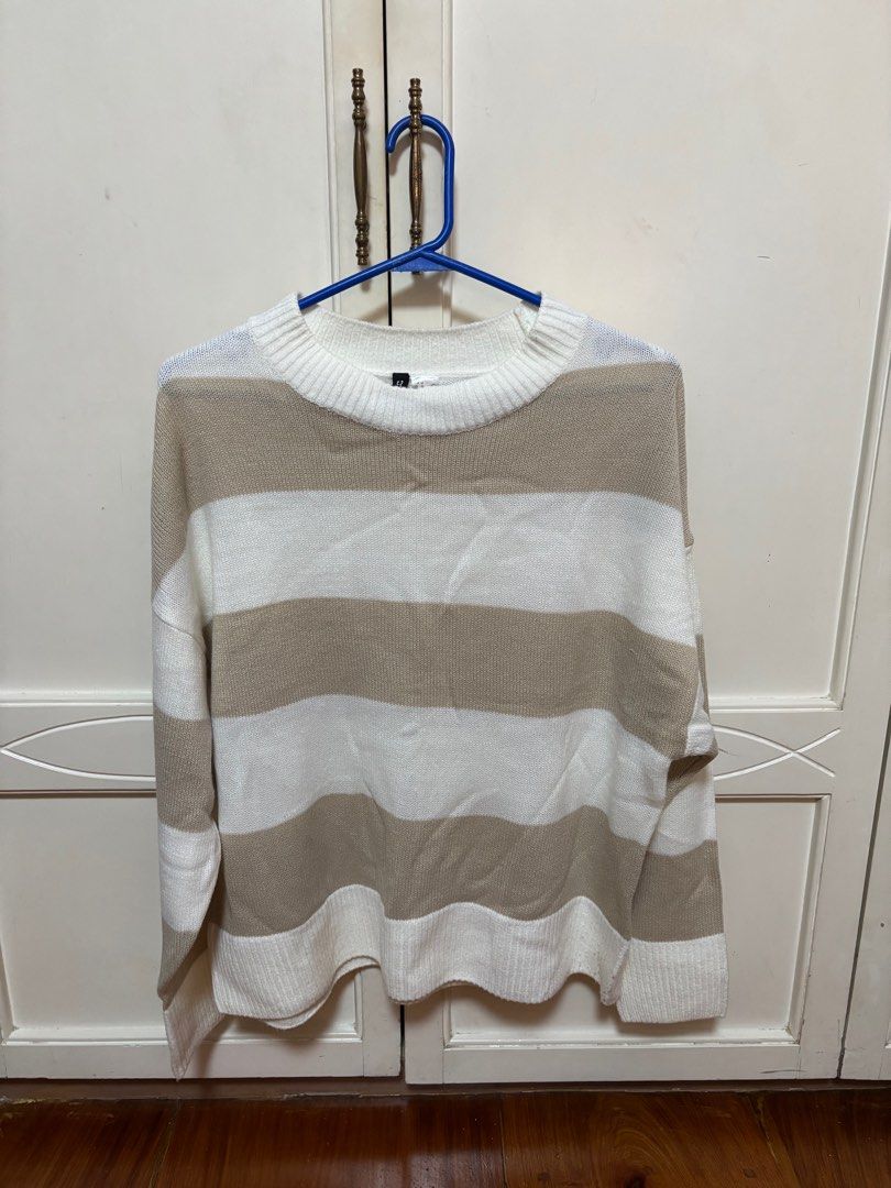 H&M Divided Striped Sweater - Size M (Category: Longsleeves) located in Quezon City. Submitted by cccarla_bc (Listing ID 1403489386, Image 1). Description: - H&M Divided sweater - Size: M - Color: White and beige stripes - Neckline: Crew neck - Sleeves: Long sleeves - Material: Knit.