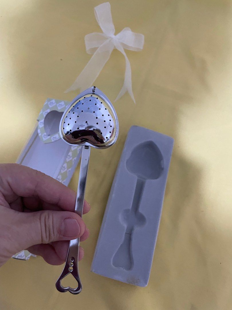 Kate Aspen Heart-Shaped Tea Infuser (Category: Coffee & Tea Tableware) located in Manila. Submitted by winnieyols (Listing ID 1403529176, Image 3). Description: Kate Aspen tea infuser is perfect for tea lovers! It features a heart-shaped infuser head and a long handle. The infuser comes in its original packaging, tied with a white ribbon. The box has a cute design with teapots and the words "Tea Time". -BRANDNEW - CAN BE USED AS TEA INFUSER OR PW