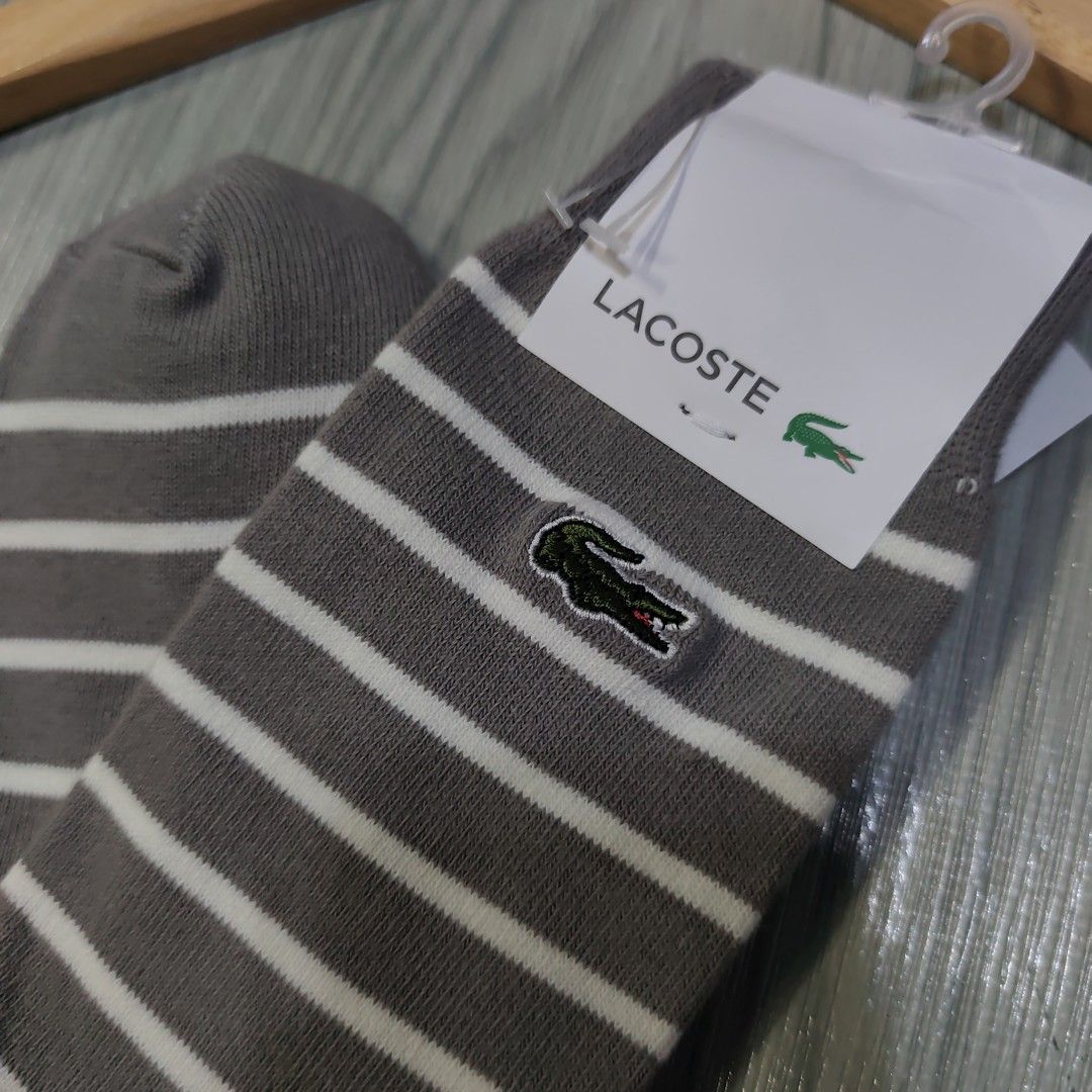 Lacoste high sock stripe (Category: Socks) located in Bauan. Submitted by fast_transact (Listing ID 1403580807, Image 3). Description: lacoste sock - high socks - stripe grey white - Lacoste embroidered logo - Comfortable fabric.