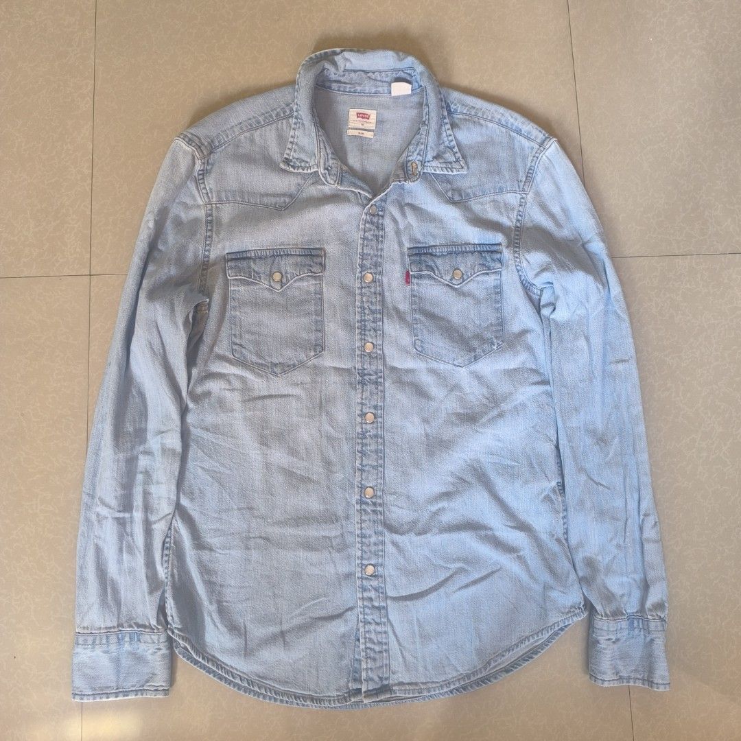 Levi's Denim Shirt - Slim Fit - Medium (Category: Tshirts & Polo Shirts ) located in Manila. Submitted by bienny-reyes98 (Listing ID 1403542469, Image 1). Description: - Light blue Levi's denim shirt - Size: Medium - Fit: Slim - Features two chest pockets - Button-down closure - Made in Bangladesh - Long sleeves with buttoned cuffs - Authentic Levi's.