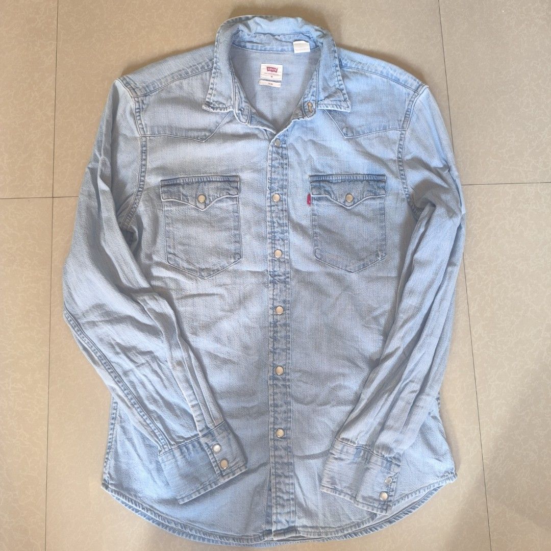 Levi's Denim Shirt - Slim Fit - Medium (Category: Tshirts & Polo Shirts ) located in Manila. Submitted by bienny-reyes98 (Listing ID 1403542469, Image 2). Description: - Light blue Levi's denim shirt - Size: Medium - Fit: Slim - Features two chest pockets - Button-down closure - Made in Bangladesh - Long sleeves with buttoned cuffs - Authentic Levi's.