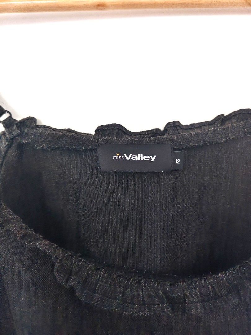 Miss Valley Black Cami Top Size 12 (Category: Sleeveless) located in Marikina City. Submitted by marrisoncollection (Listing ID 1403595029, Image 3). Description: - Miss Valley black cami top - Size 12 - Adjustable spaghetti straps - Ruffled neckline - Textured fabric - Versatile style.