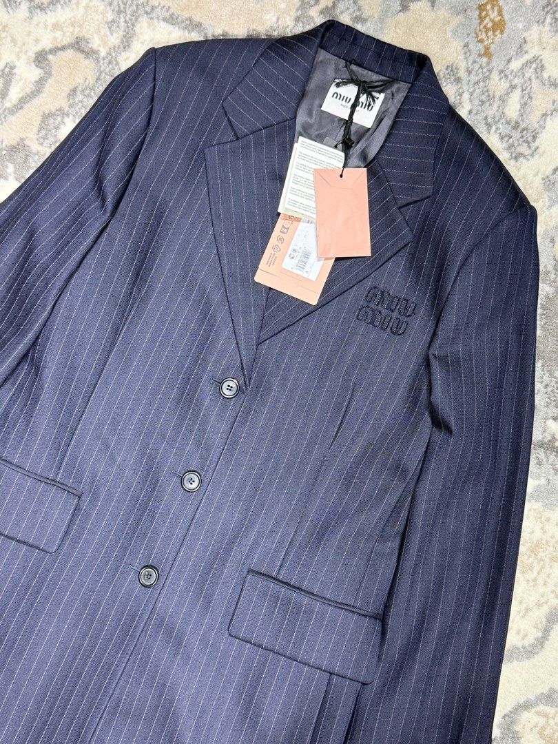 Miu Miu Pinstripe Coat Size 40 (Category: Luxury Apparel) located in Manila. Submitted by aevan143 (Listing ID 1403511554, Image 3). Description: - Authentic Miu Miu coat - Size 40 - Pinstripe design - Classic lapel - Three-button closure - Embroidered Miu Miu logo - Includes original tags - Made in Italy.