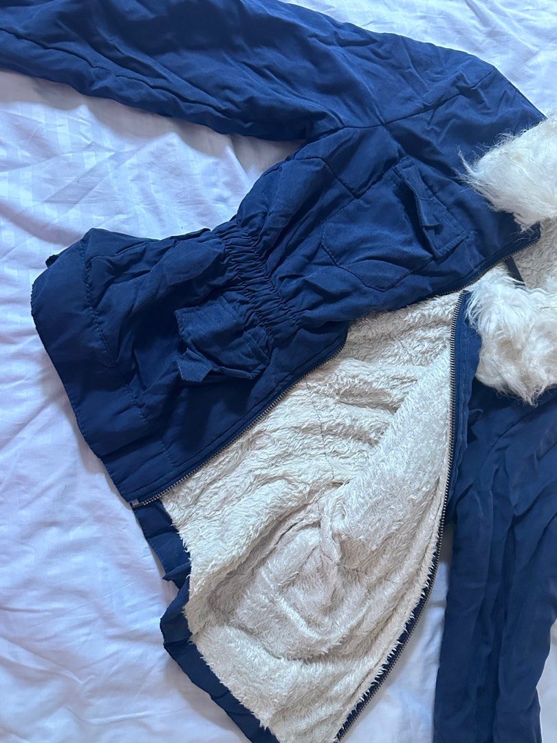 Navy Blue Jacket with Fur Collar (Category: Coats, Jackets and Outerwear) located in Taguig. Submitted by dentisimo (Listing ID 1403507432, Image 2). Description: - Navy blue jacket - Detachable fur collar - Stylish fur collar - Zippered front - Cinched waist - Multiple pockets - Lined with soft, warm material - Perfect for cooler weather - Versatile for any outfit.