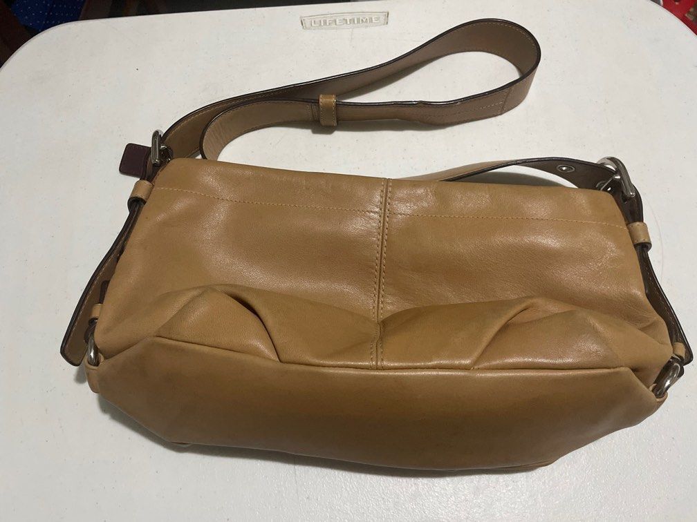 Original Coach Tan hobo mesenger bag (Category: Shoulder Bags) located in Las Pinas. Submitted by alsaclayan (Listing ID 1403520657, Image 1). Description: Need to sell a lot of my items because I’m moving out soon. All original from US and Europe. I don’t have boxes or paperbags because I did not intend to sell them, they were for my personal use. Well taken care of and kept in my bag/shoe closet..