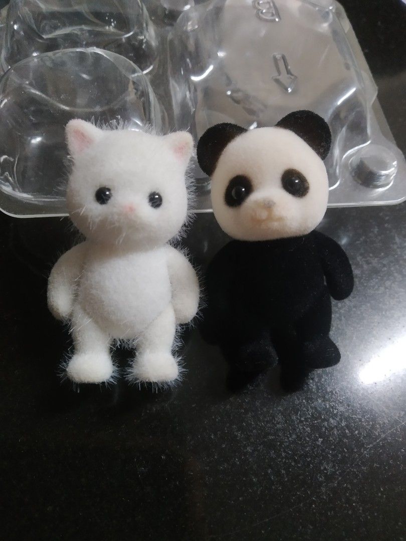 Sylvanian Families Set (Category: Designer & Blind Box Toys) located in Manila. Submitted by cattss__ (Listing ID 1403563952, Image 1). Description: persian - preloved, with dust panda - bnew MOP: gcash + sf MOD: jnt or lalamove loc: tondo, manila No Return No Exchange.