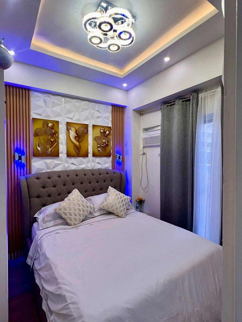 The Atherton (Category: Vacation Rentals) located in Makati City. Submitted by mayangqoh05 (Listing ID 1403443129, Image 2). Description: Welcome to our stylish condo featuring modern interior design with 2 spacious bedrooms, a large dining table, and a cozy living room. Our upgraded kitchen includes a microwave oven and a unique electric stove from London. Enjoy top-notch AMENITIES • Free Wifi • Kiddie pool • 65inch Flat screen TV • Adult pool •