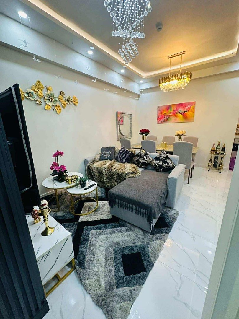 The Atherton (Category: Vacation Rentals) located in Makati City. Submitted by mayangqoh05 (Listing ID 1403443129, Image 3). Description: Welcome to our stylish condo featuring modern interior design with 2 spacious bedrooms, a large dining table, and a cozy living room. Our upgraded kitchen includes a microwave oven and a unique electric stove from London. Enjoy top-notch AMENITIES • Free Wifi • Kiddie pool • 65inch Flat screen TV • Adult pool •