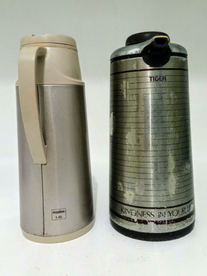 Tiger VACUUM THERMOS BUNDLE (Category: Pitchers & Dispensers) located in Manila. Submitted by eriiicaspage (Listing ID 1399283932, Image 1). Description: PREOWNED WellUsed Branded VACUUM THERMOS BUNDLE TIGER Japan brand thermos 1.9 L. Silver Satin ,Sign of Used ,Flaws , Nagfade un Printed Design . .Still Good to Use . Masflex Vacuum thermos ,Pink Metallic , 1.6L . Min Sign of Used ,NaStucked na lang. No oTher flaws .Good Condition . Rfs : for dec