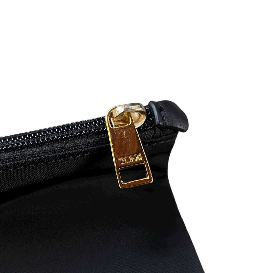 TUMI Nylon Zip Pouch (Category: Luxury Bags & Wallets) located in Bacolod City. Submitted by treasurehunts.6100 (Listing ID 1403516305, Image 3). Description: Tumi Pouch Condition - Excellent Color - Black Color rate - 9.7 / 10 Flaws - None.