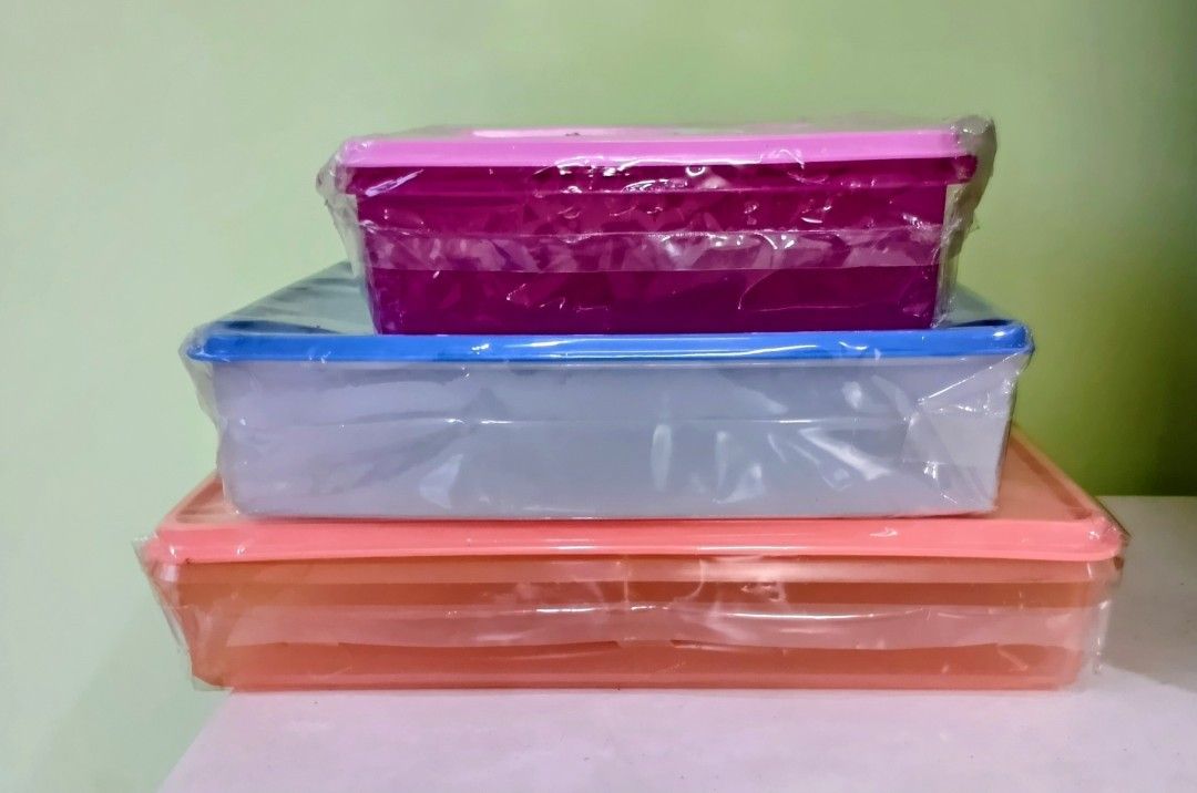 Tupperware Rectangular/Squarish Containers (Category: Food Organisation & Storage) located in Singapore. Submitted by beeyong169 (Listing ID 1403530908, Image 2). Description: Offering 40% off the retail price, which is my best price. From $10. Orange (34x23x7 cm) Retail $26.30, selling $15 Blue (28.5x23x7 cm) Retail $20.90, selling $12 Pink (22x22x7 cm) Retail $16.90, selling $10.