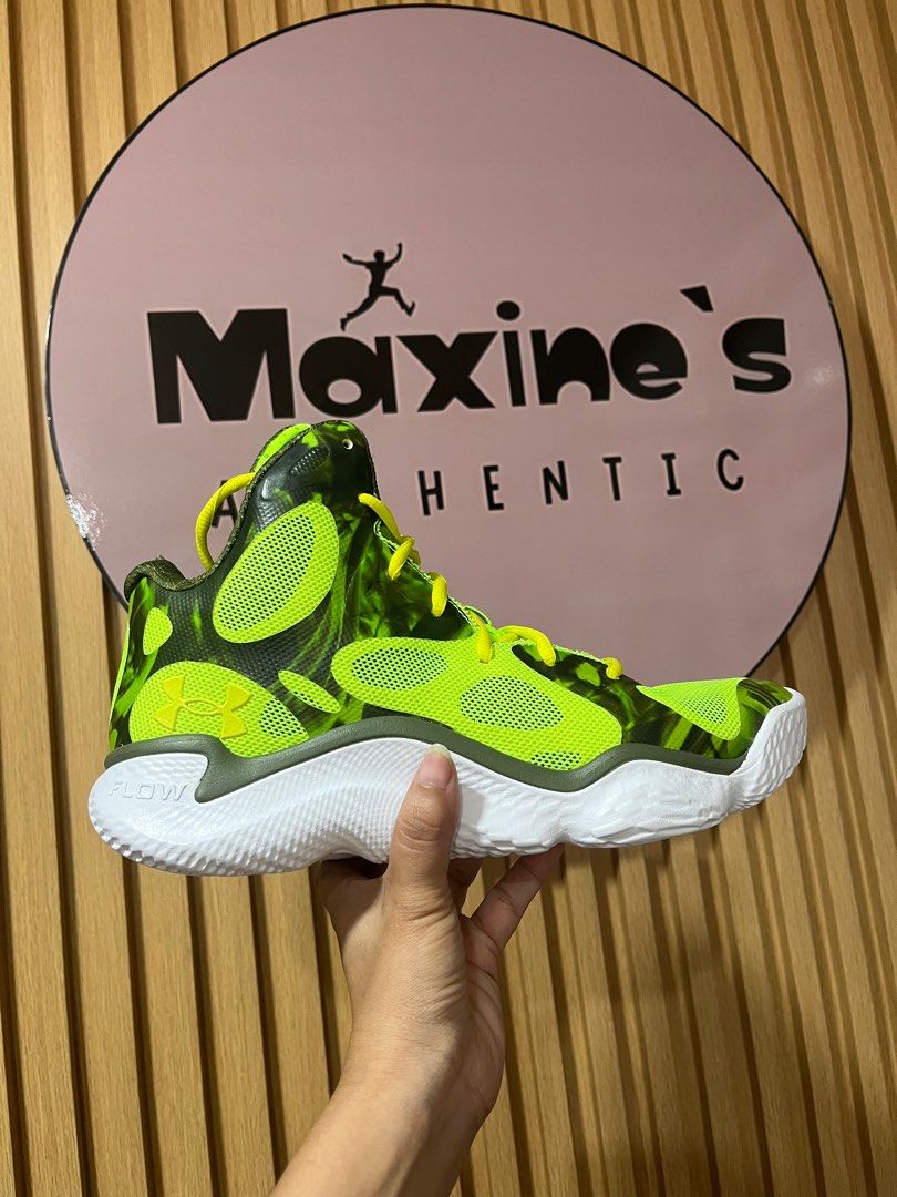 Under Armour Flow Basketball Shoes (Category: Sneakers) located in Pinamalayan. Submitted by chay0921 (Listing ID 1403447153, Image 1). Description: - Under Armour Flow basketball shoes - Eye-catching green and black color scheme - Stylish white sole with yellow accents - High-top design for ankle support - Features the Under Armour logo - Ideal for basketball and everyday use.