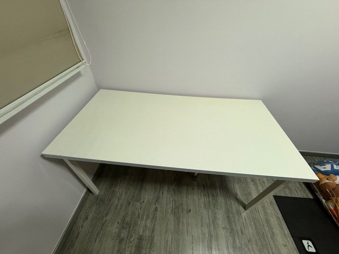 White Study Table (Category: Tables & Sets) located in Singapore. Submitted by herlinayeo (Listing ID 1403561972, Image 1). Description: - White study table - Ideal for small spaces - Minor signs of use - Sturdy and functional - Stable legs - 150 cm x 75cm.