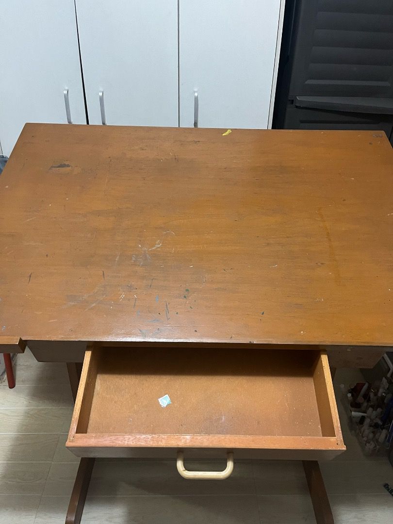 Wooden Drafting Drawing Table with Drawer (Category: Tables & Sets) located in Quezon City. Submitted by selcouthjay (Listing ID 1403427272, Image 2). Description: - Wooden drafting table - Adjustable angle - Spacious surface 2'x3' ft - Convenient storage drawer - Sturdy wooden frame - Ideal for artists and architects - Features a handle for easy movement - theres paint stains n light scratches.