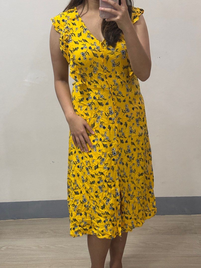 Yellow Dress with Ruffle Sleeves (Category: Dresses) located in Angeles City. Submitted by twixieee_ (Listing ID 1403563998, Image 1). Description: Brand: Casual Collections by F&F Color: Yellow with floral print Size: Medium Style: Button-down midi dress with ruffle sleeves 🌼 *rope/tie missing 🚛 Shipping nationwide via LBC/JnT/Flash (shouldered by the buyer) 📍 Pampanga Location #FloralDress #PrelovedPH #SummerOOTD #YellowDress #BeachOutfit #B