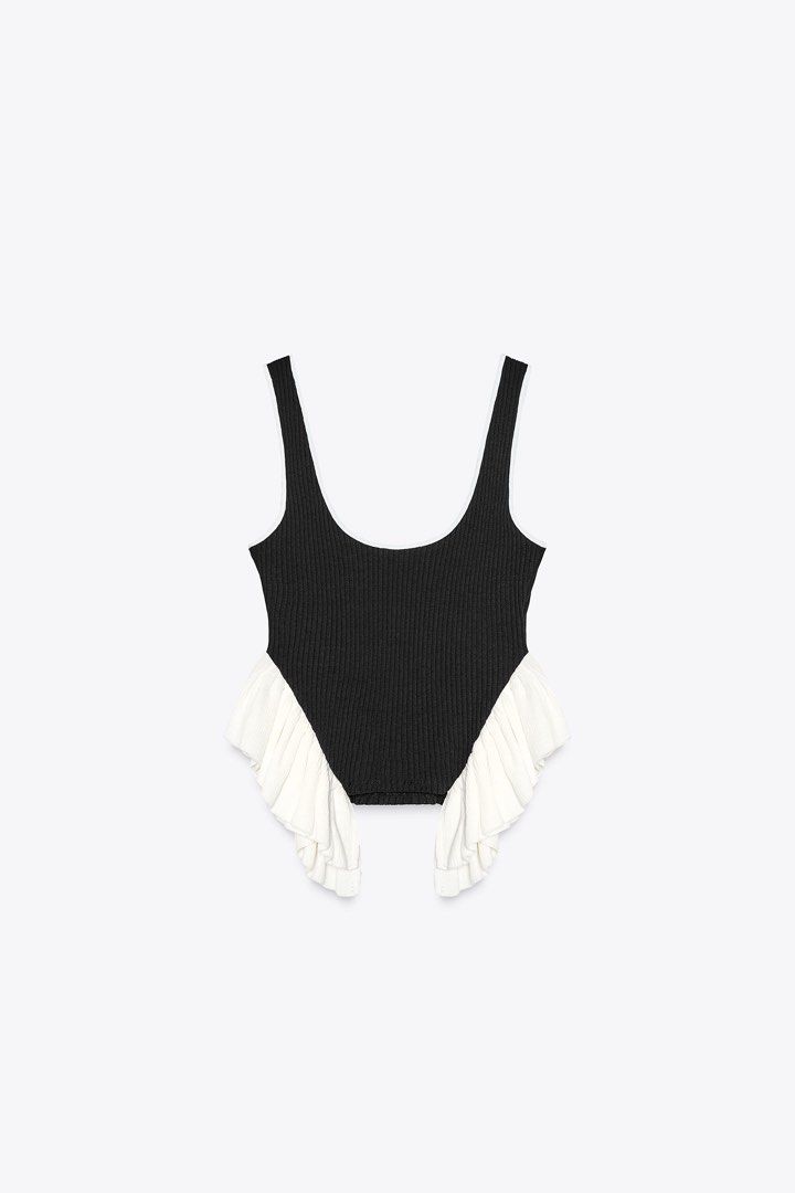 Zara Black Ribbed Top with White Ruffle (Category: Sleeveless) located in Manila. Submitted by cb_curations (Listing ID 1403594918, Image 1). Description: Zara black sleeveless ribbed top with white ruffle Used once Rfs: decluttering.