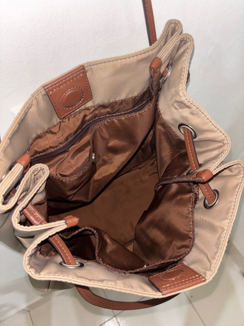 Agnes B. Beige Tote Bag (Category: Tote Bags) located in Shah Alam. Submitted by xdflakez (Listing ID 1403770690, Image 2). Description: Agnes B. tote bag . Made in China. Premium material composition includes nylon and cow leather..