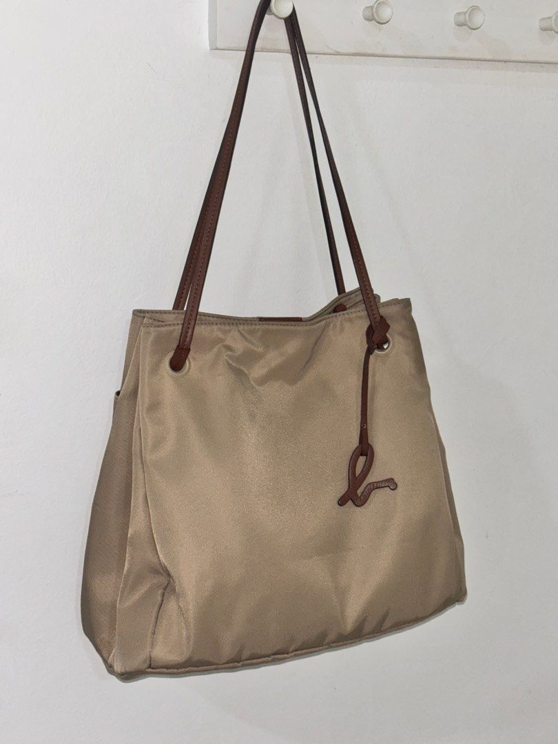 Agnes B. Beige Tote Bag (Category: Tote Bags) located in Shah Alam. Submitted by xdflakez (Listing ID 1403770690, Image 1). Description: Agnes B. tote bag . Made in China. Premium material composition includes nylon and cow leather..