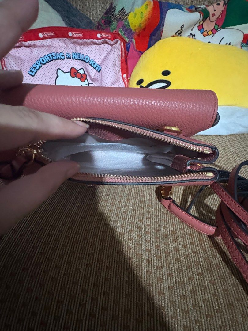 Authentic Coccinelle (Category: Luxury Bags & Wallets) located in Quezon City. Submitted by gringottsss (Listing ID 1403779126, Image 3). Description: Authentic with box calf leather top handle gold-tone clasp detachable shoulder strap Product measurements Depth 5 cm Height 15 cm Width 20 cm.