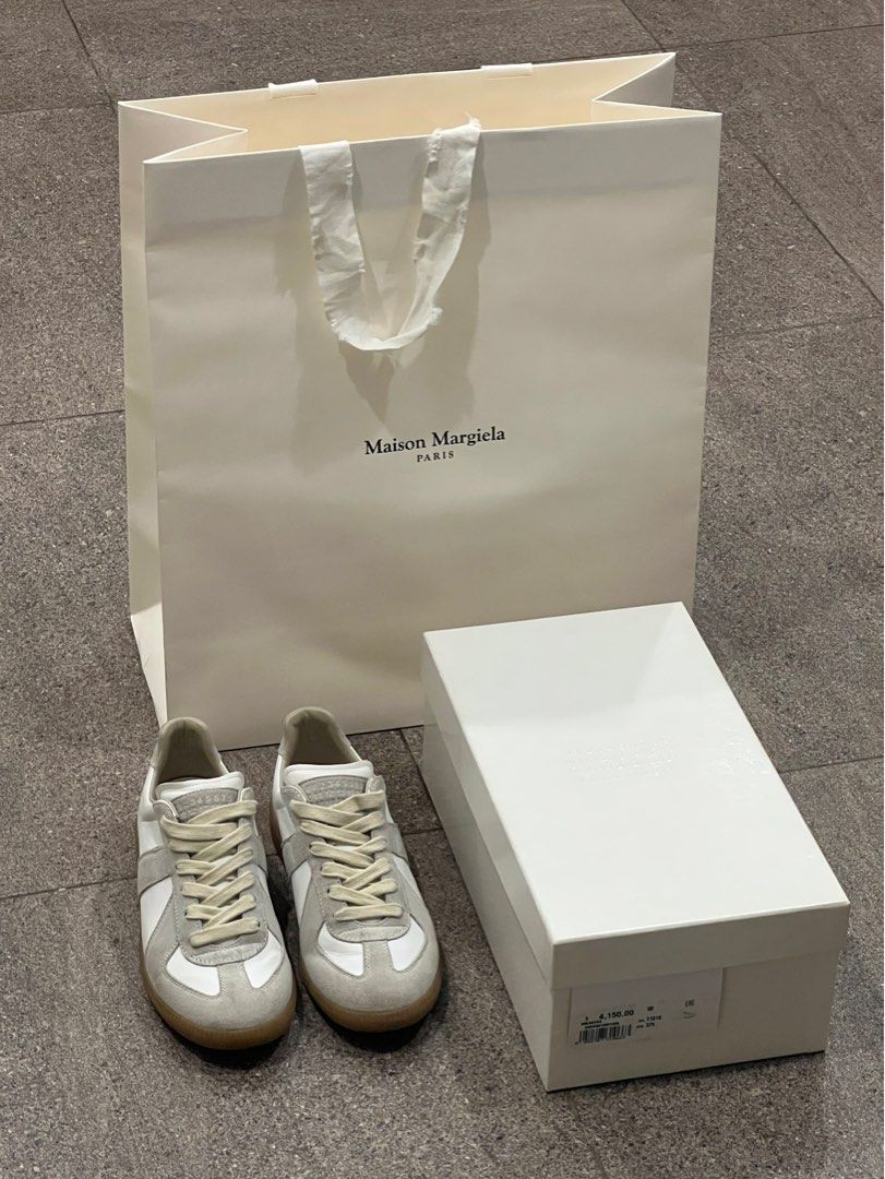 Authentic Maison Margiela GATs Sneakers (Category: Sneakers & Footwear) located in Santa Rosa. Submitted by _nxxy (Listing ID 1403762317, Image 2). Description: Authentic Maison Margiela White Replica Sneakers. Complete with paper bag, box, and dust bag. Lightly used..