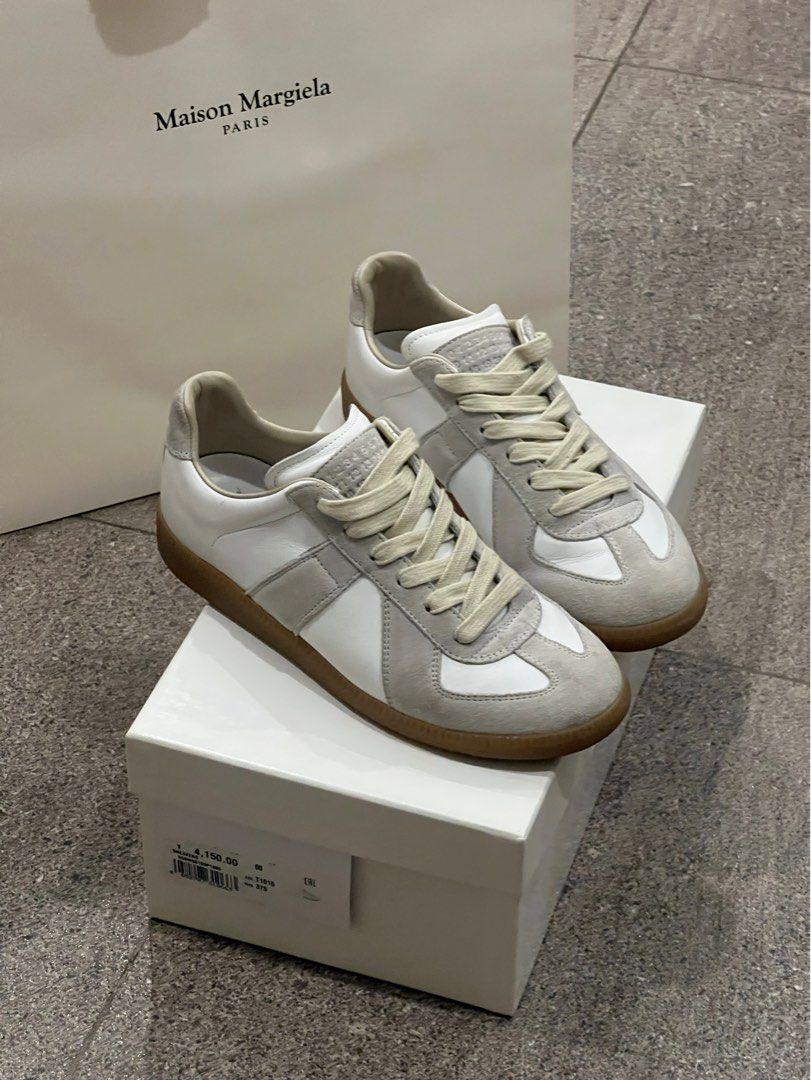 Authentic Maison Margiela GATs Sneakers (Category: Sneakers & Footwear) located in Santa Rosa. Submitted by _nxxy (Listing ID 1403762317, Image 1). Description: Authentic Maison Margiela White Replica Sneakers. Complete with paper bag, box, and dust bag. Lightly used..
