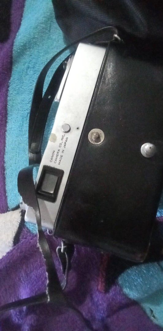 Canon QL Camera with National PE-2850 Flash (Category: Cameras) located in Manila. Submitted by chevyrede36083 (Listing ID 1403737391, Image 3). Description: - Vintage Canon QL camera - Canon SE 45mm 1:1.8 lens - National PE-2850 flash unit - Black leather case included - Flash features ASA/DIN dial and on/off switch - Made in Japan.