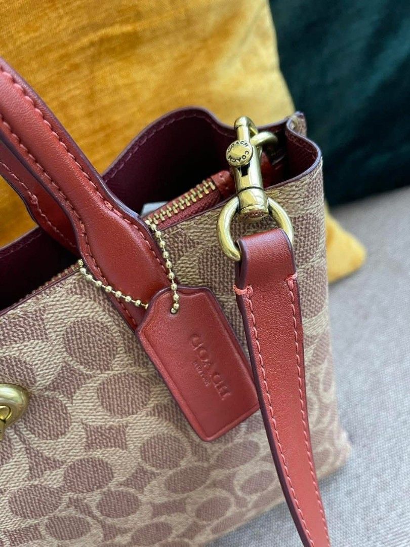 Coach Mini Tote Bag (Category: Luxury Bags & Wallets) located in Manila. Submitted by chichays_closet (Listing ID 1403791975, Image 3). Description: - Coach Mini Tote Bag - Signature monogram pattern - Top handle and detachable shoulder strap - Zip closure - Interior pocket - Gold-toned hardware - Exterior: Light brown with red accents WILLOW classic satchel bag Best seller Color last 3 pcs nalang talaga to Do not miss out on these must-have piec