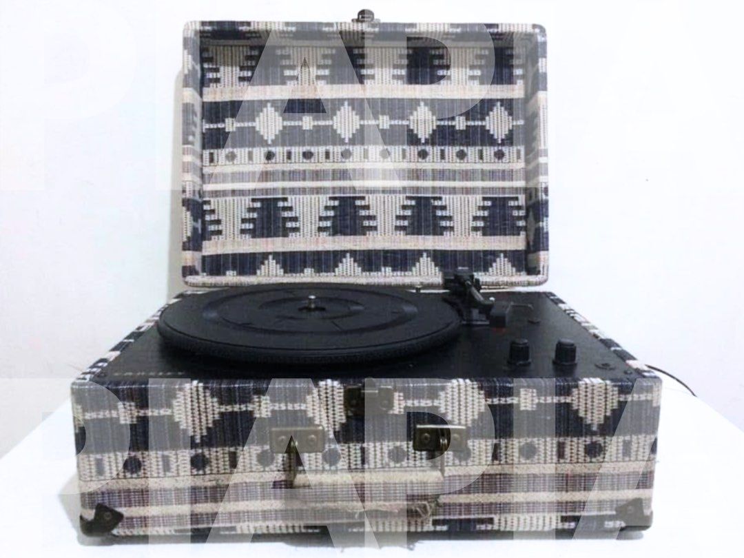 Crosley Portable Turntable (Category: Portable Music Players) located in Manila. Submitted by piapareja1996 (Listing ID 1403735538, Image 1). Description: - Crosley portable turntable - Unique patterned exterior - Black turntable and controls - Secure closing lid - Includes power cable - In good working order.