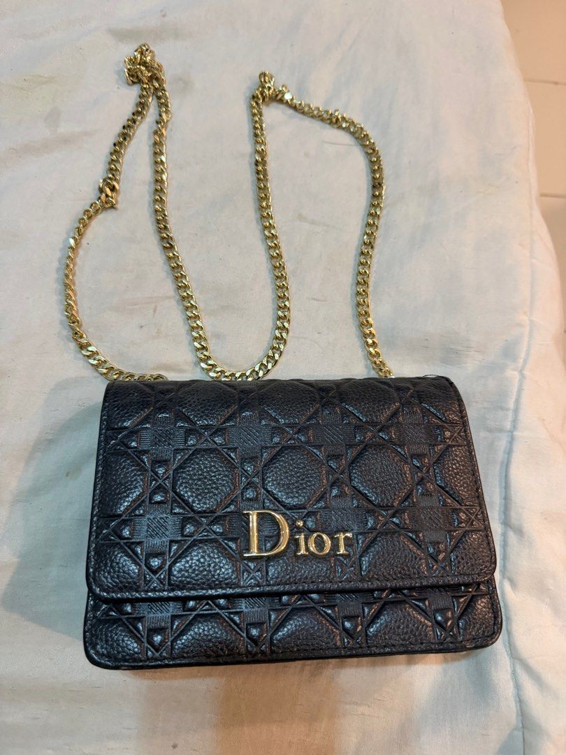 Dior Black Chain Bag (Category: Luxury Bags & Wallets) located in San Pedro. Submitted by jhoyce48 (Listing ID 1403636165, Image 3). Description: Black Dior chain bag with gold-tone hardware. Features a quilted design with the Dior logo on the front. The interior includes a compartment with a magnetic closure. The bag has a chain strap for shoulder or crossbody wear. The bag is made of leather. .