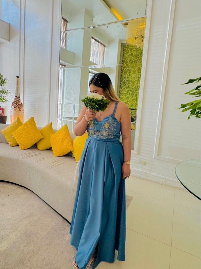 Dusty Blue Bridesmaid Gown Large (Category: Evening dresses & gowns) located in Rizal. Submitted by bhe.mm (Listing ID 1403692506, Image 2). Description: Pinatahi ko lang to. Measurement ng body ko ay 36-38 Bust (adjustable dahil criss cross likod nito, pinasadya ko talaga keysa zipper. padded yong gown. 34 waistline Large body frame ako. 5'1-5'2 height ko. Duchess fabric eto kaya maganda ang tela. pinatahi ko to sa 2k . worn once. 1,200 nalang N