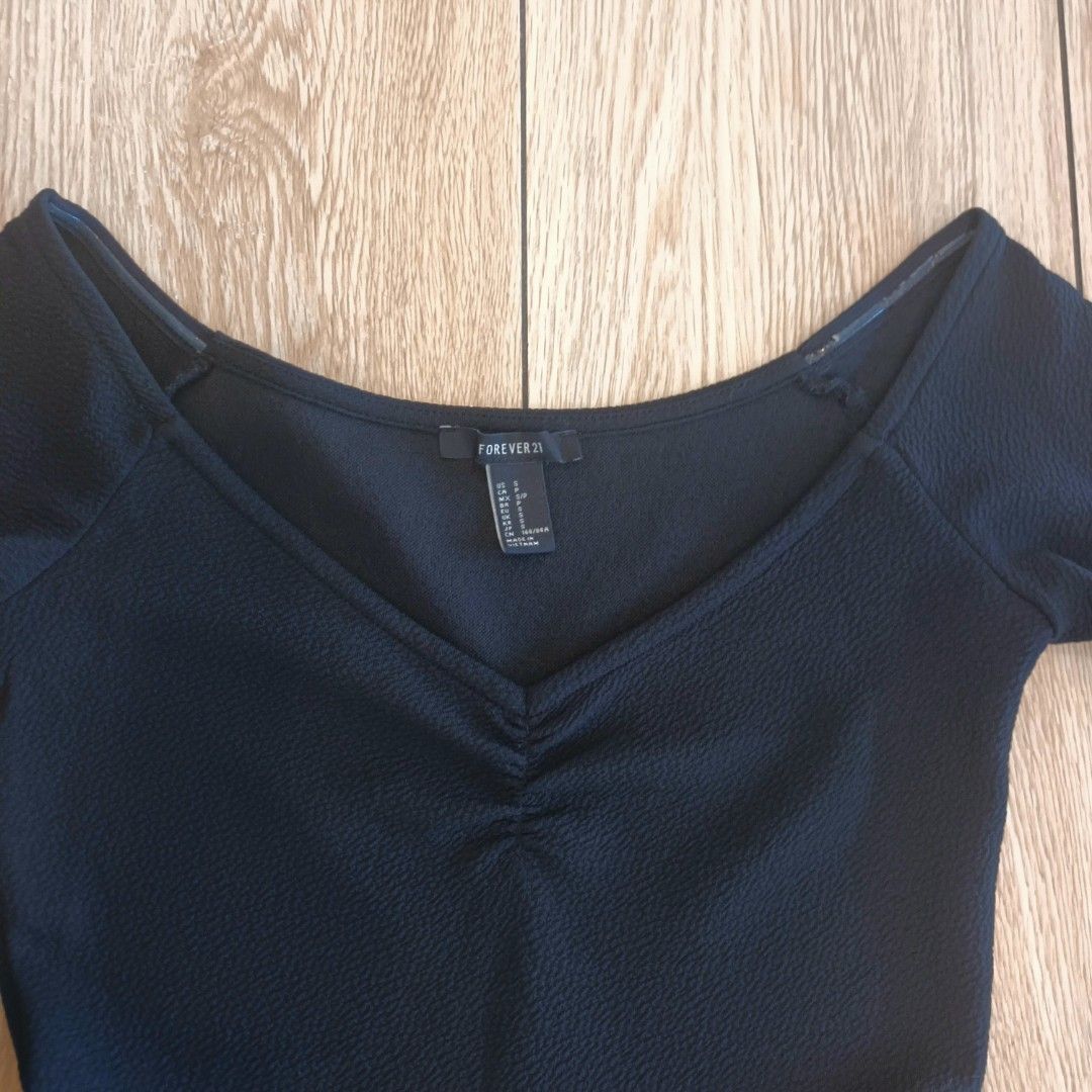 Forever 21 Black Off-Shoulder Dress (Category: Dresses) located in Makati City. Submitted by cdiana (Listing ID 1403665180, Image 3). Description: - Size: S/P - used once for an event - no when worn, actual Forever21 ad/model for reference - flaw: slight chipped anti-slip on the left side, see the last photo - Three-quarter length sleeves - Design: Fitted bodice with gathered bust, A-line skirt - Textured polyester fabric.